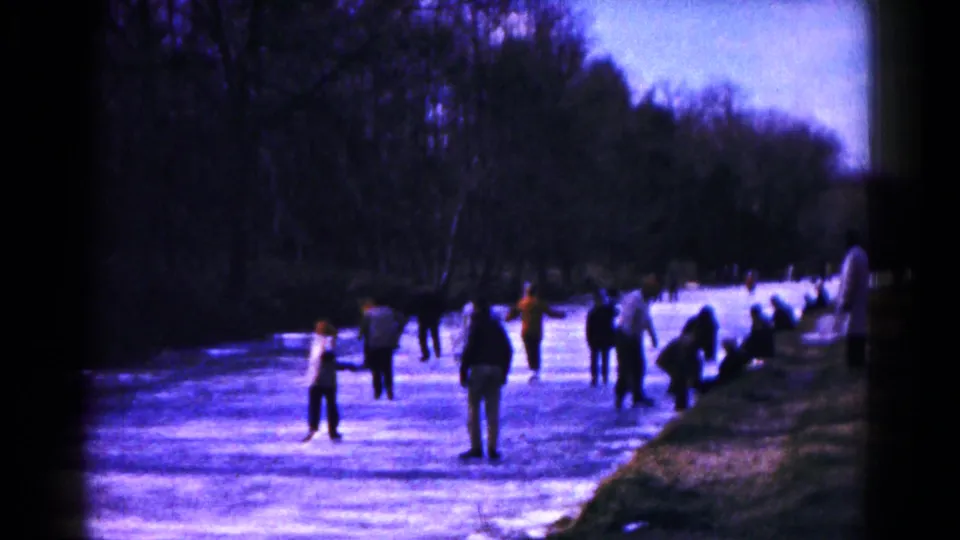 A wider 1961 Hagerstown winter view shows multiple people skating or standing on a frozen pond, with bare trees in the background and a dark bank along the right side.