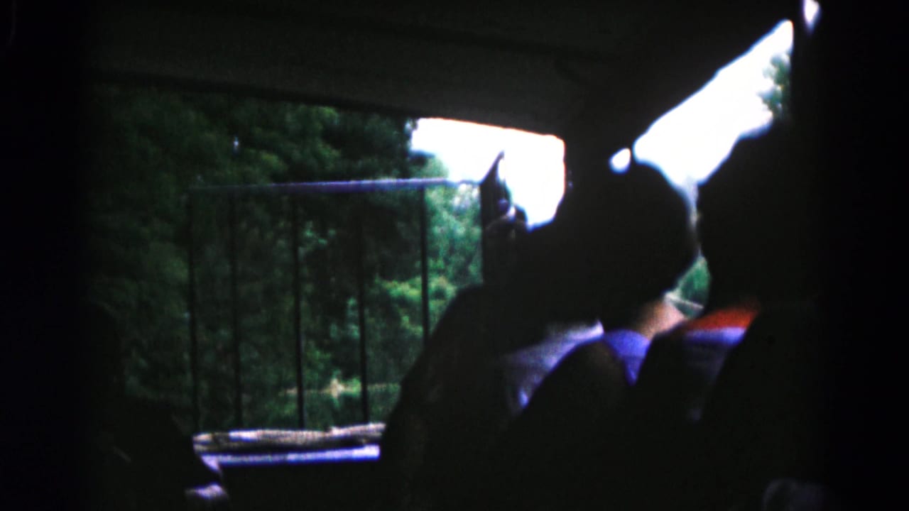 The final frame shows boys in shadow beside a window, with a wooded outdoor view and metal railing visible in 1961 Maryland 8mm footage.