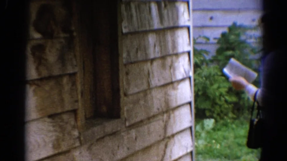 At the end of the 1962 Catskill shot, the group leaves the frame, with wooden siding, a dark doorway, greenery, and a handbag still visible.
