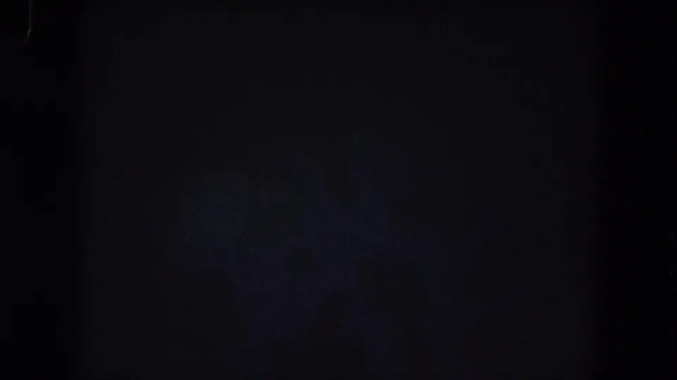 Very dark final frame from the Summit County night aerial clip, with faint bluish haze and minimal visible detail.