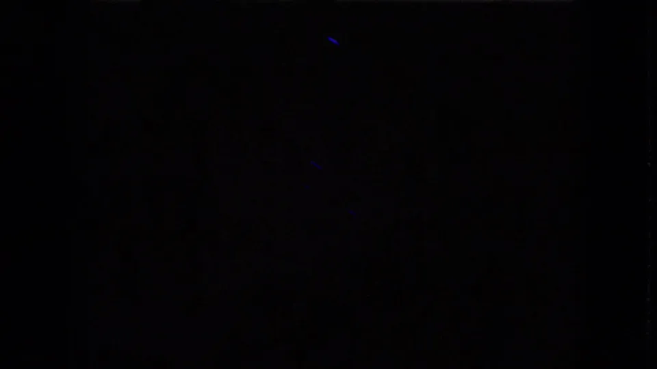 End frame from the 8mm clip appears mostly dark, likely between exposed moments in the home-movie footage.