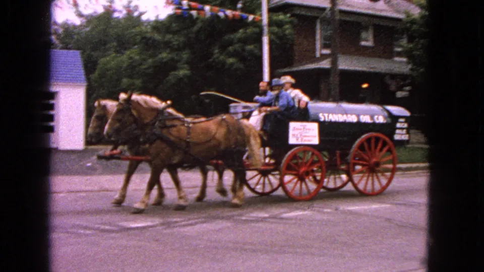 The Standard Oil Co. wagon is seen side-on as horses and riders pass through the Barrington parade scene.