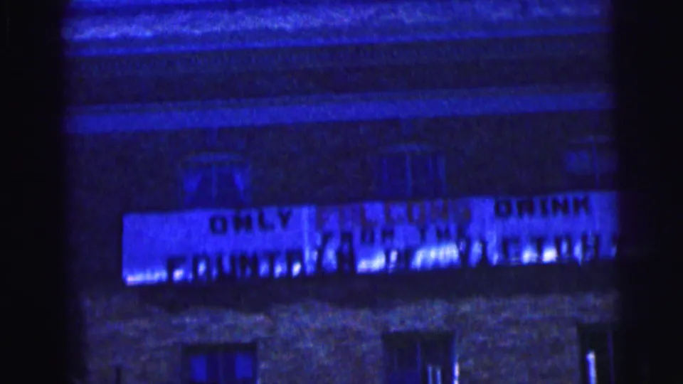 Bowling Green University night exterior from 1963 with the Falcons victory sign visible on the building.