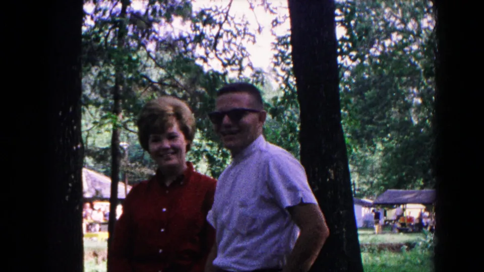 A close view shows the couple smiling in the wooded 1963 Cold Springs recreation area.