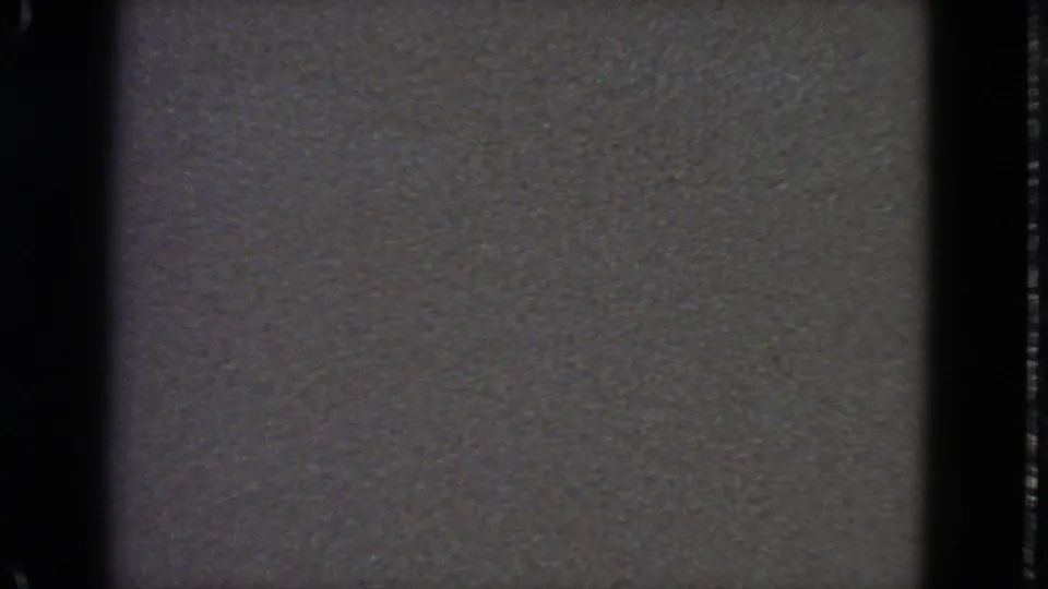 Final 1963 San Francisco frame shows static-like gray texture with dark 8mm edges and no identifiable subjects.