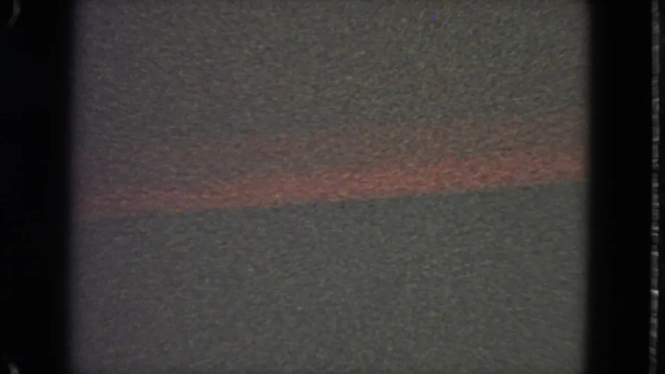 1963 8mm San Francisco reel frame with a muted blank field, dark borders, and a faint red horizontal streak near the top.