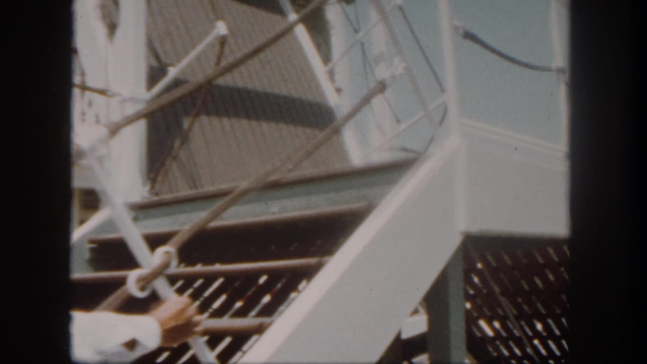 Close view of dock structure and railings beside a riverboat at Disneyland.
