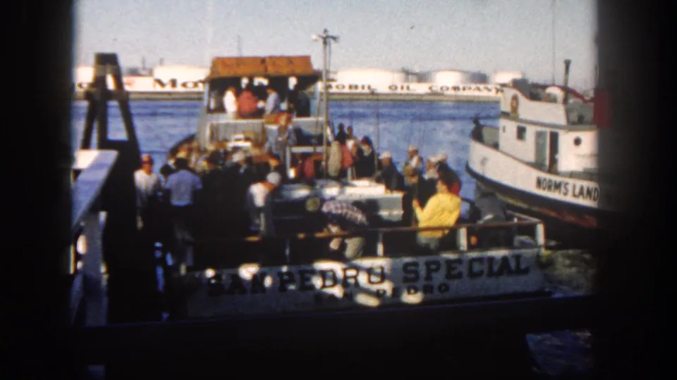 1962 San Diego waterfront view of the San Pedro Special ferry, passengers on deck, and the nearby Norm's Land boat.