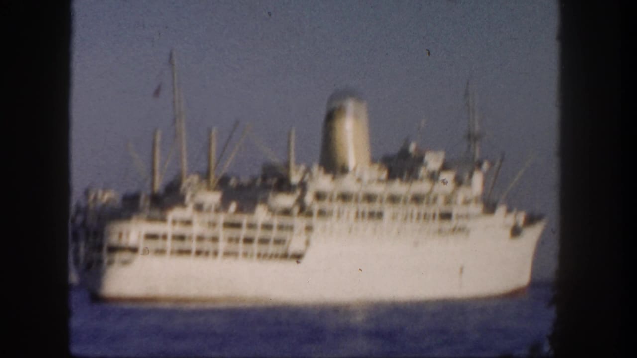 White ocean liner on calm blue water with dark 8mm frame borders.