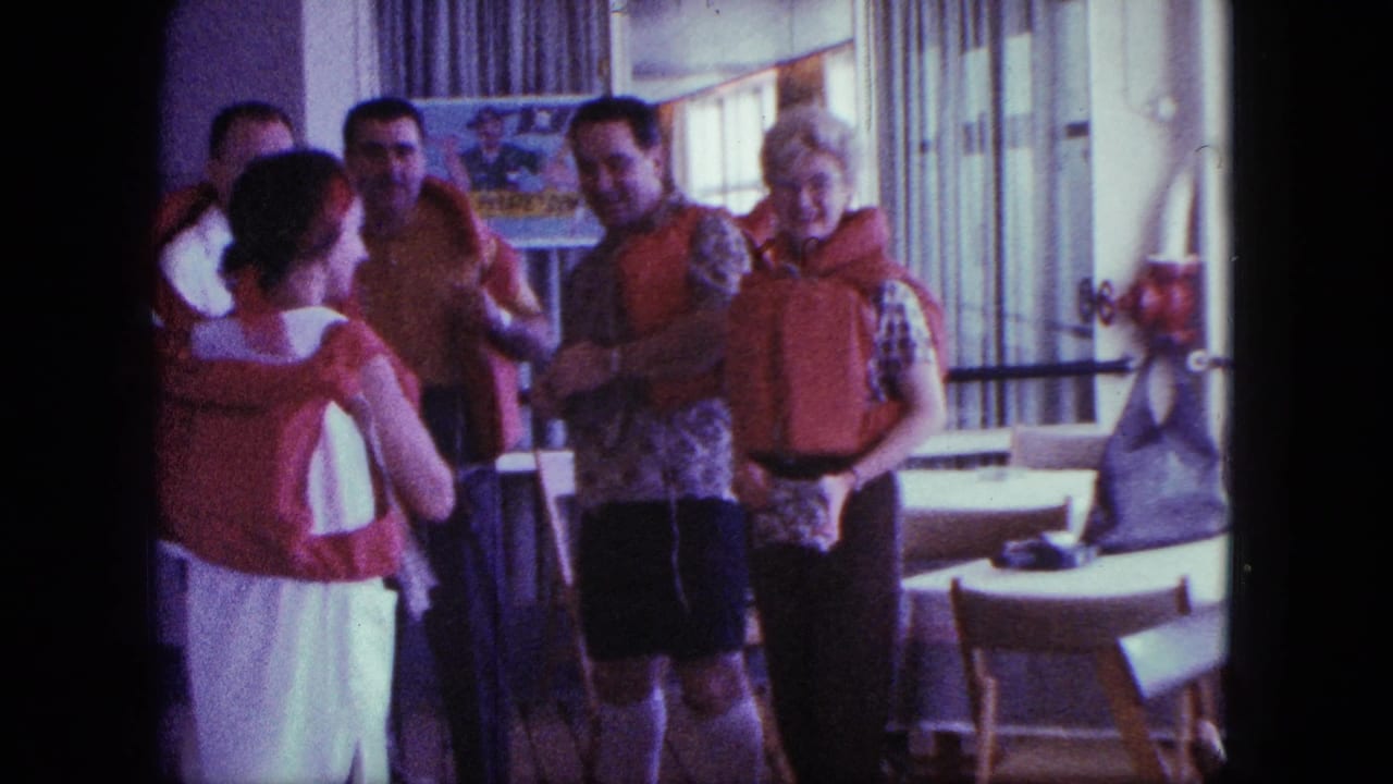 A woman stands with her back to the camera as adults in a 1963 cruise-ship lounge adjust bright life preservers.