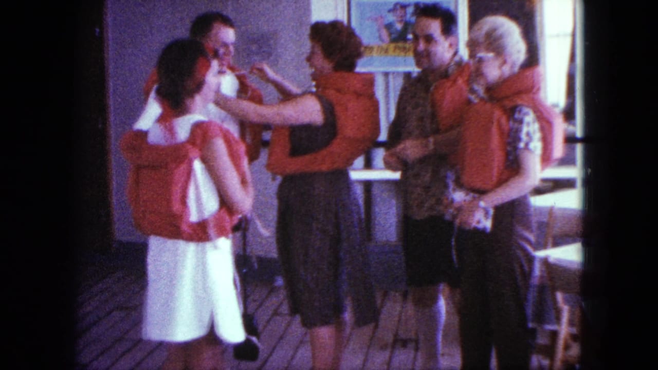 Adults in 1963 San Diego stand in life jackets on a deck while a woman gestures toward another person's jacket straps.
