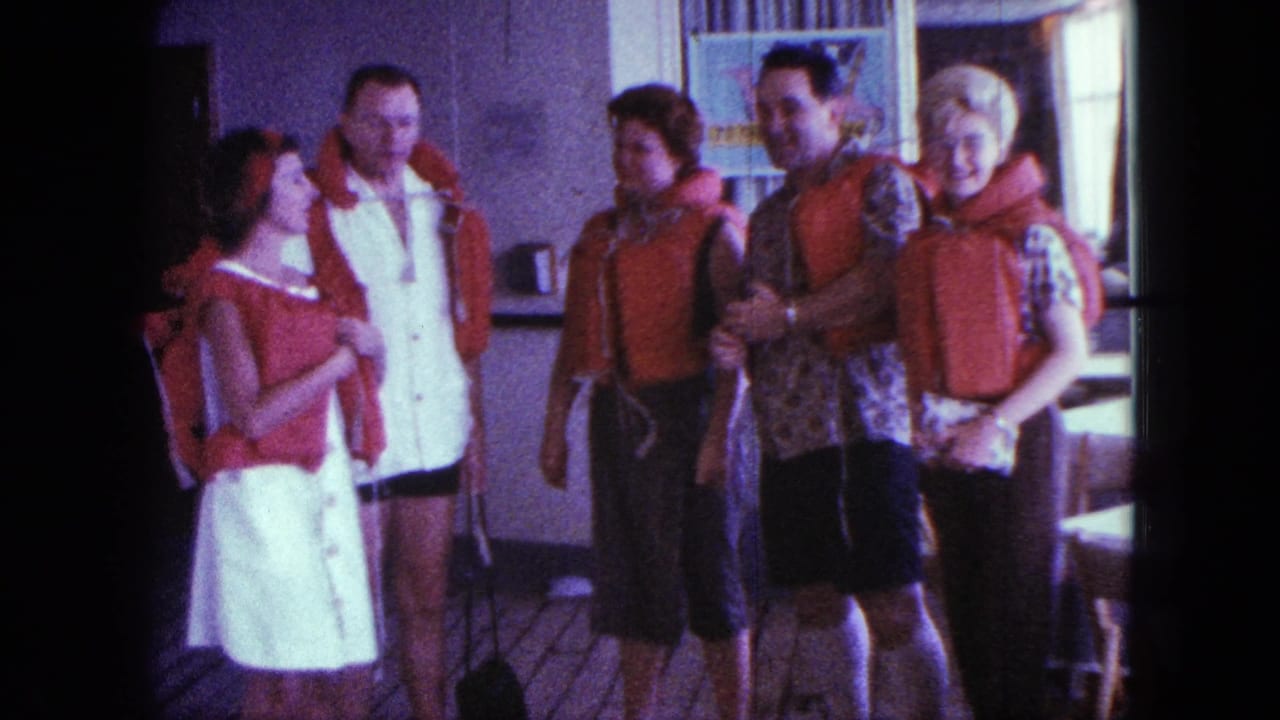 Adults in red life jackets stand close together on a boat deck in the supplied 1963 San Diego vacation footage.