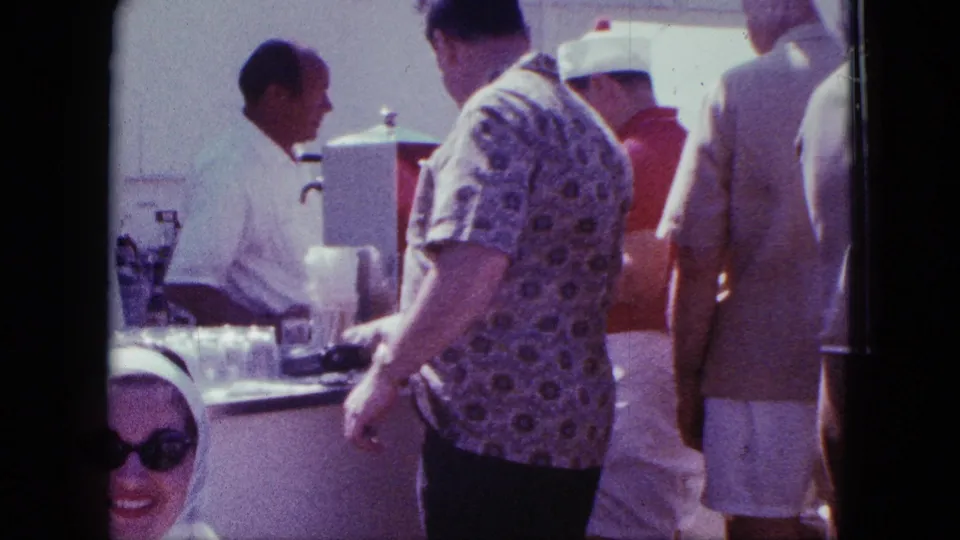 Final frame shows adults at a San Diego bar or grill counter, with the bartender behind the counter and a woman in sunglasses partly visible.