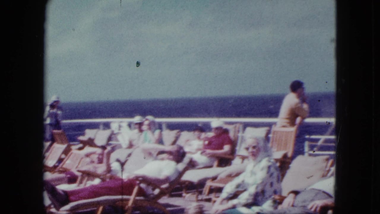 1963 8mm San Diego cruise-liner footage showing adults relaxing on sunlit deck chairs near the open ocean.