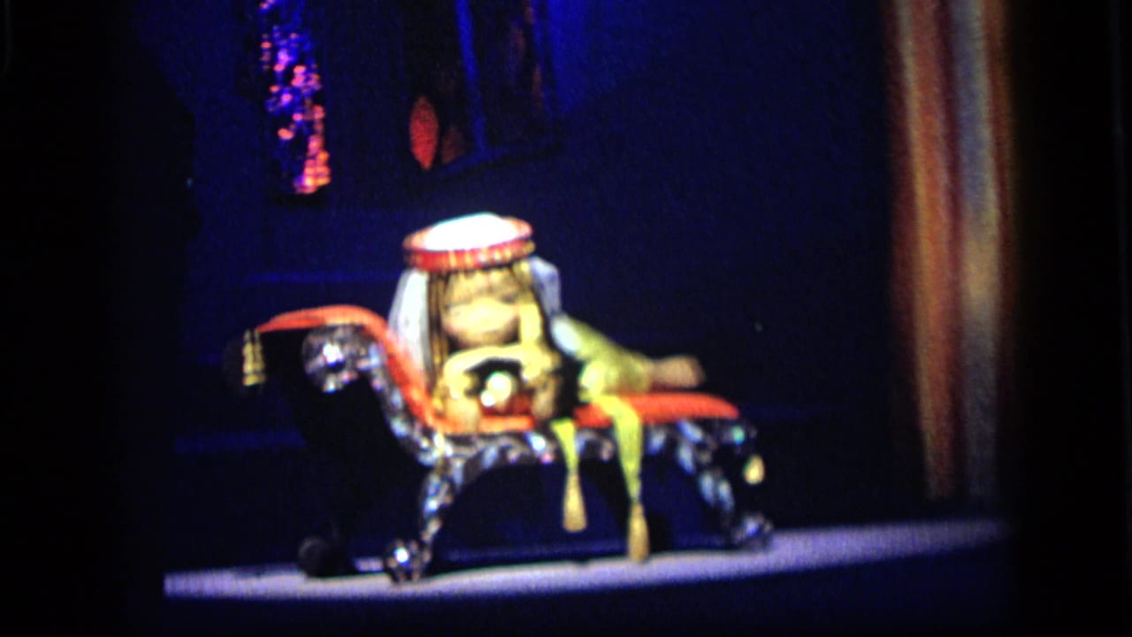 Final 1964 Camden frame showing the costumed rider and mechanical horse display in saturated 8mm color.