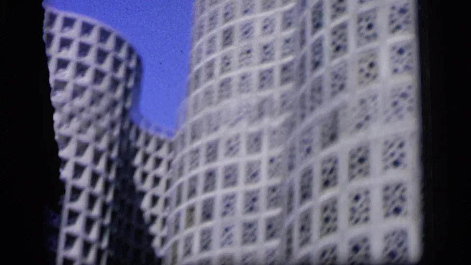 1964 Camden frame with a curved white geometric facade filling most of the home-movie view.