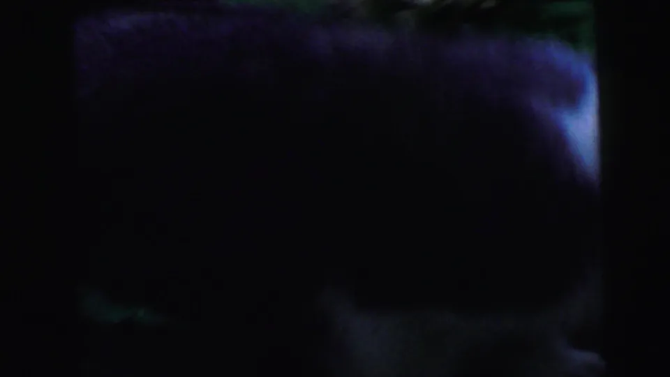 Near-total darkness with faint indistinct form, suggesting a camera pan or abrupt transition in this 1964 8mm home movie reel.