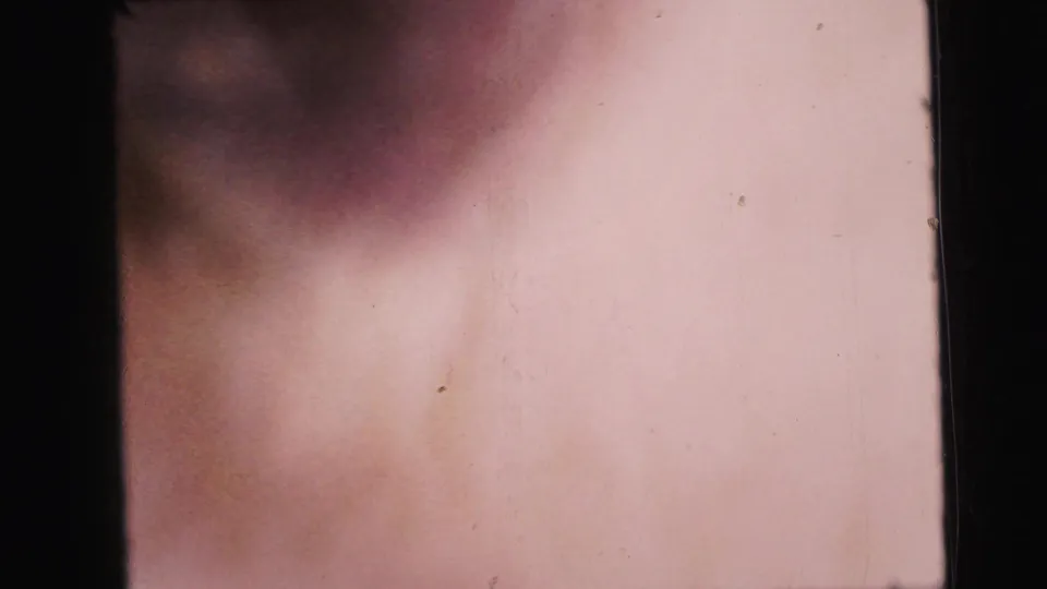Blurred flesh-tone fill frame, likely caused by the subject passing too close to the 8mm camera lens at the end of the shot.