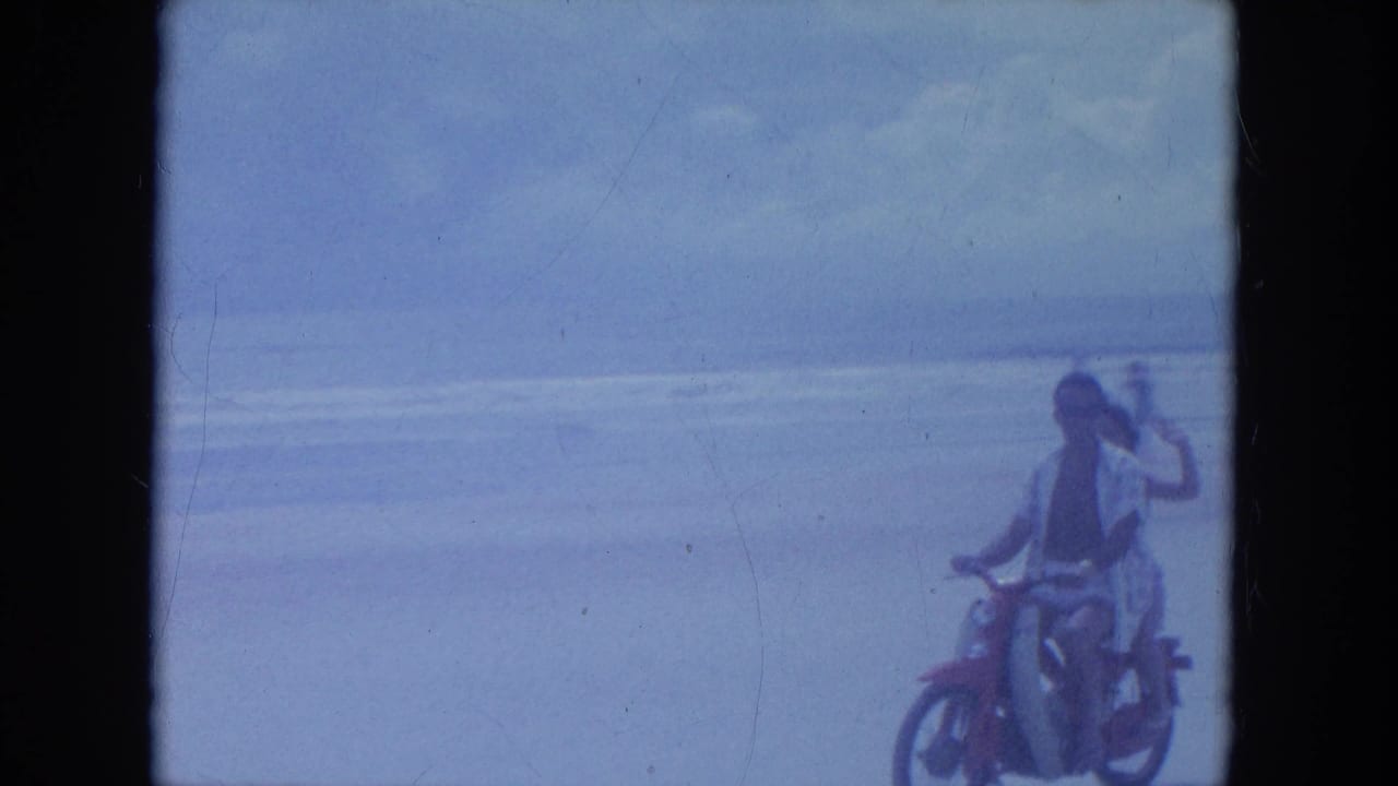 At the end of the 1964 Clearwater beach clip, the riders pass close to camera with the passenger still gesturing near the surf.