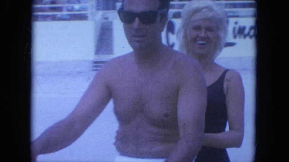 A close home-movie frame shows the couple on the scooter, the woman smiling behind the shirtless driver in Clearwater.