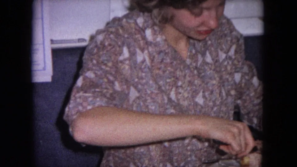 In the final frame, the woman reaches across the plate while serving meat, with the kitchen background partly visible.