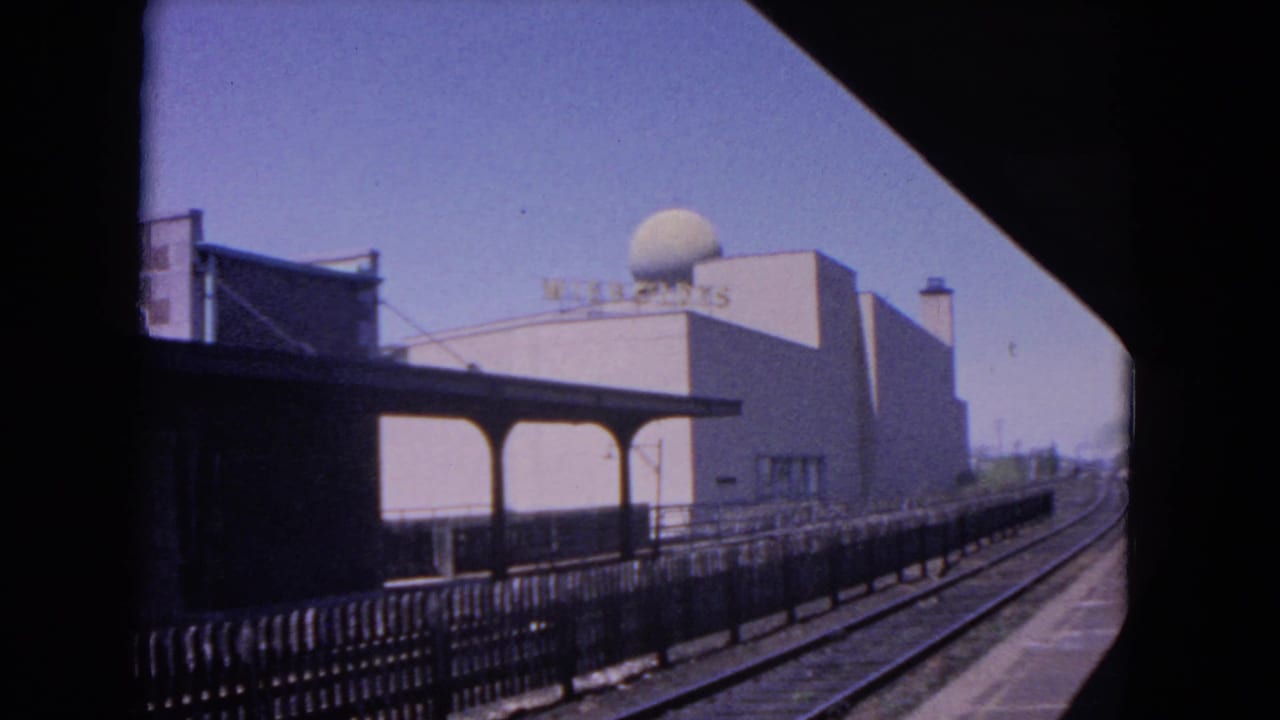 Railroad tracks and a station platform seen from a train window in Evanston.