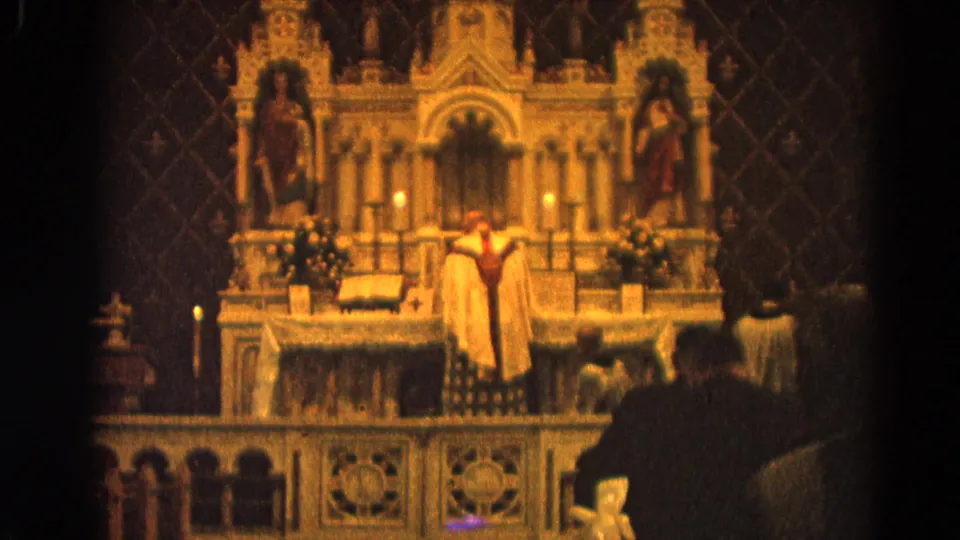 1964 Harvard, Illinois Catholic ceremony with clergy at the altar, framed by statues, candles, and parishioners in silhouette.