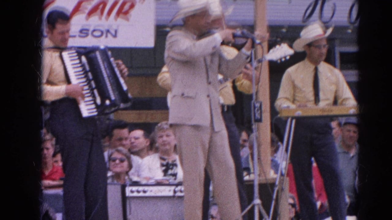 Band performance at the Harvard Radio Fair, with violinist in white hat framed between accordion and keyboard players.