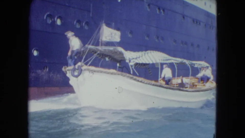 A wider side view shows the white launch running beside the ship, with a bow sailor, striped canopy, and people seated under cover.