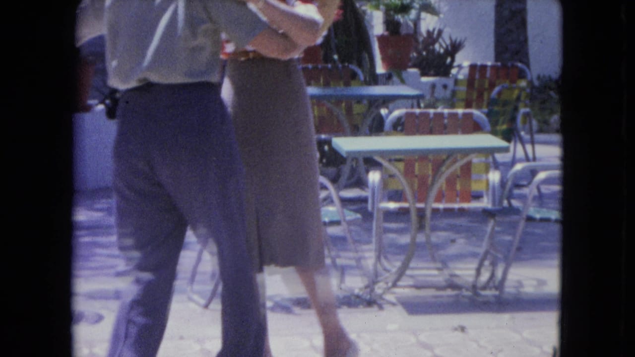 A 1964 Kingston patio scene shows the couple mid-dance, with the man in dark trousers and the woman in a knee-length skirt.
