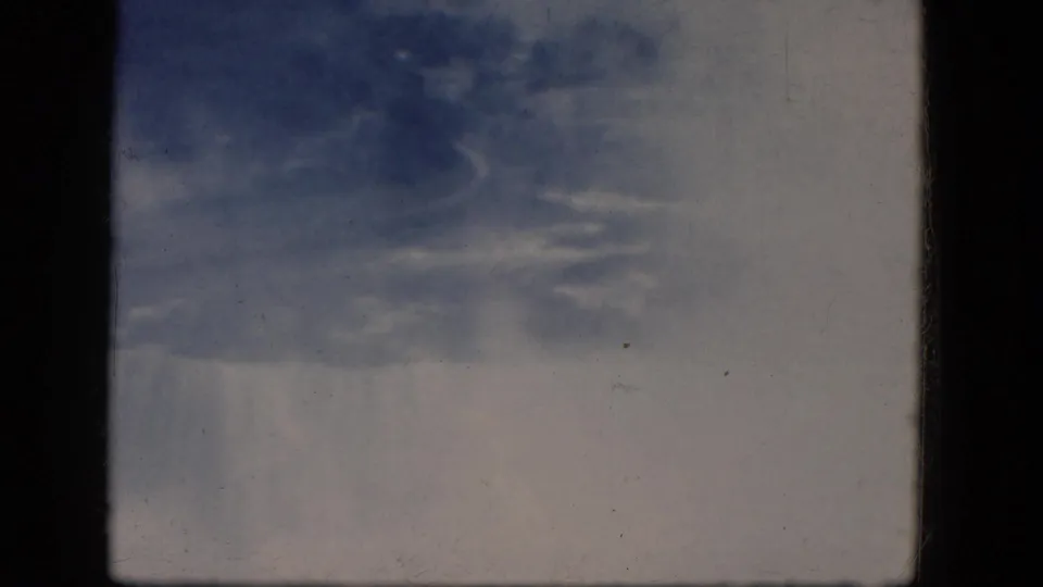 Faded 8mm frame from Niagara Falls, Canada, showing the brink area and mist at Horseshoe Falls.
