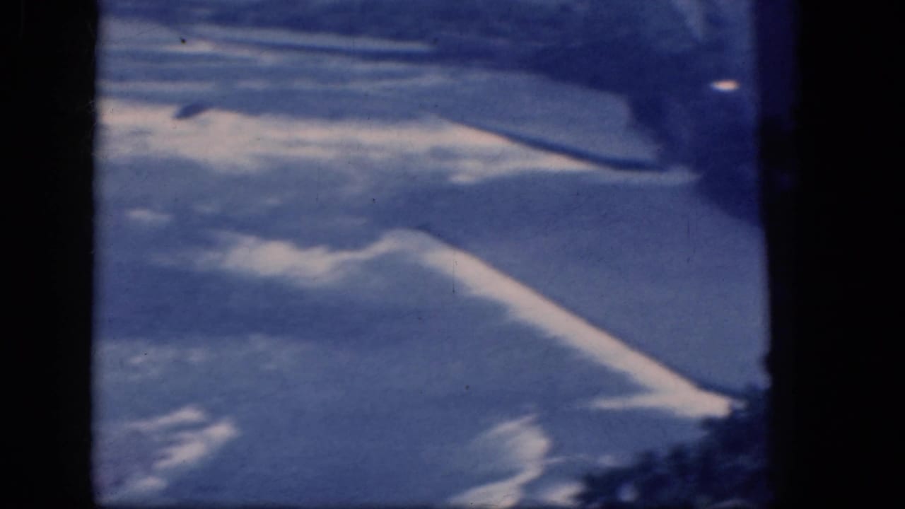 Blue-white aerial surface with dark window edge at the side.