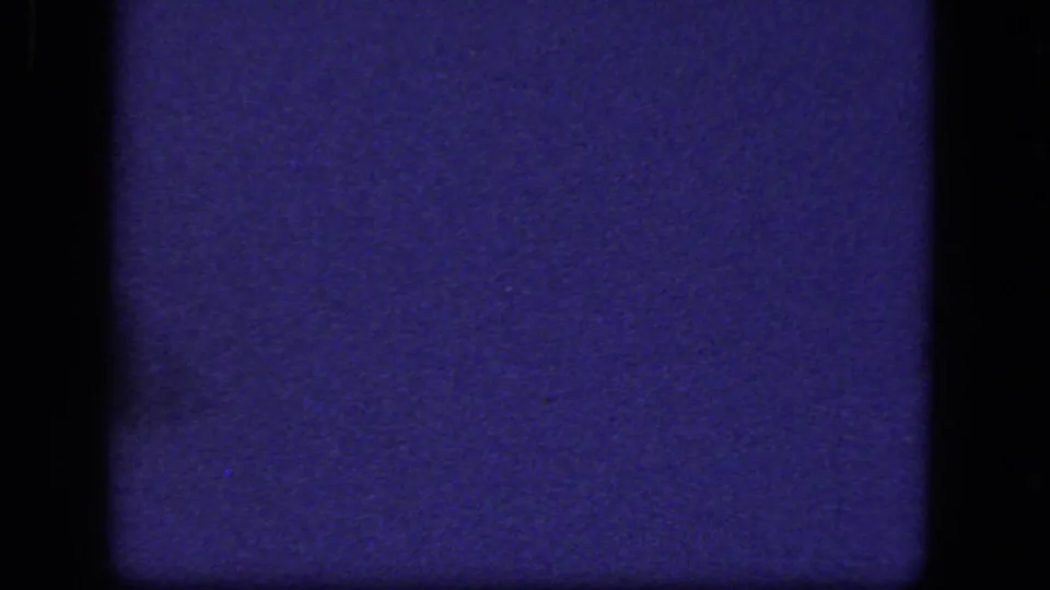 The final frame is largely dark blue and grainy, with no clear subject visible in the 8mm scan.