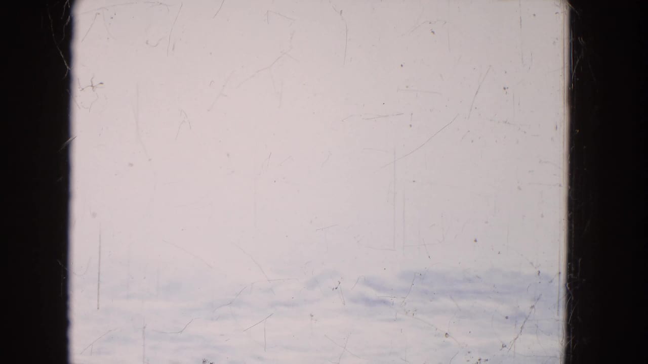 1964 8mm Niagara Falls footage begins with a washed-out misty view, faint water movement, scratches, and heavy frame borders.