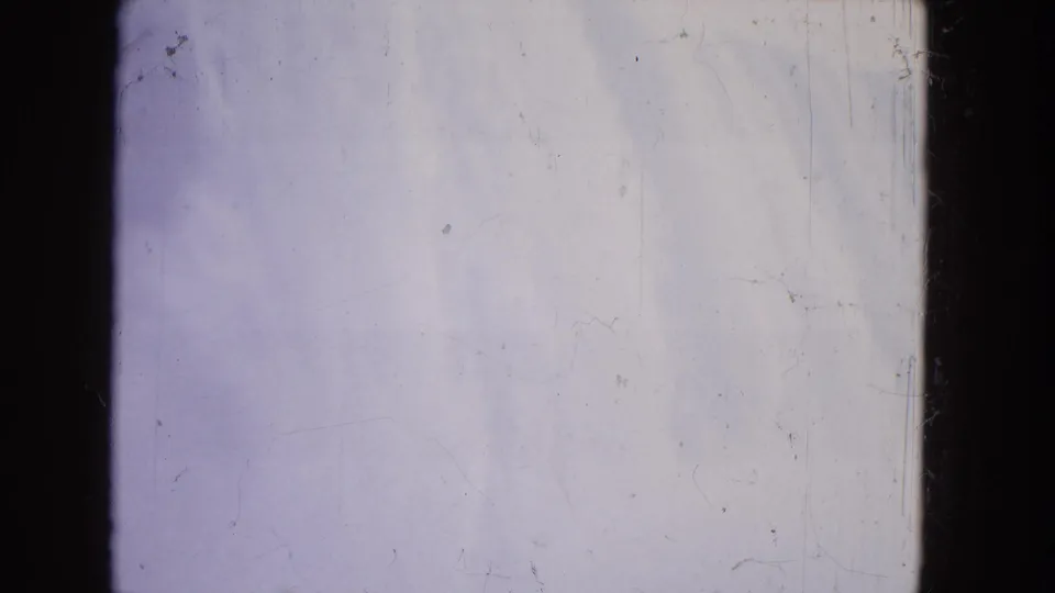 1964 Niagara Falls 8mm frame showing pale water and mist, blue-purple tint, dark gate edges, and film scratches.