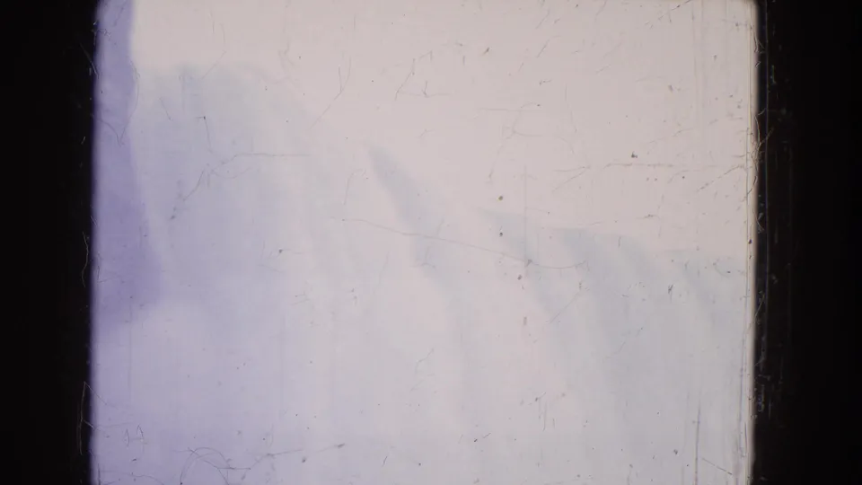 1964 Niagara Falls 8mm frame with pale spray, mist, lavender color cast, scratches, dust, and dark frame edge.