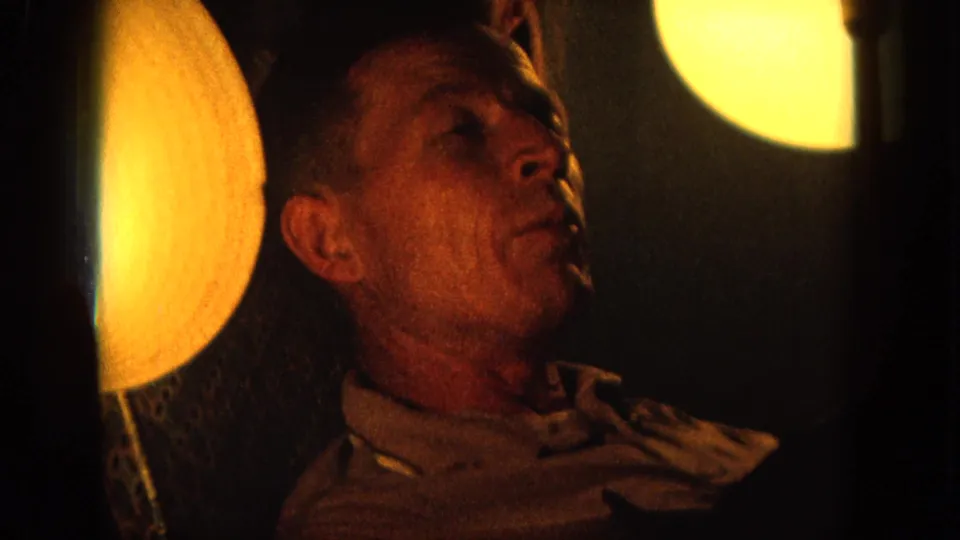 Final frame of the 1964 Hawaii performance clip, showing the singer close to camera under warm stage lighting.