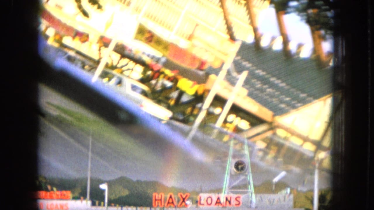 Tilted view of roadside signage with HAX LOANS lettering.