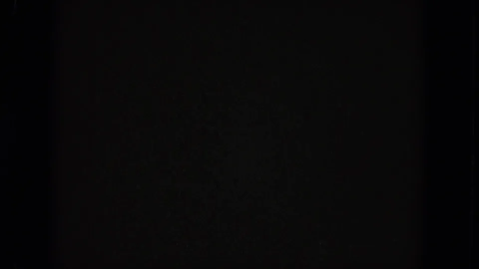 Final 8mm frame appears nearly black, with faint grain and edge texture at the end of the shot.