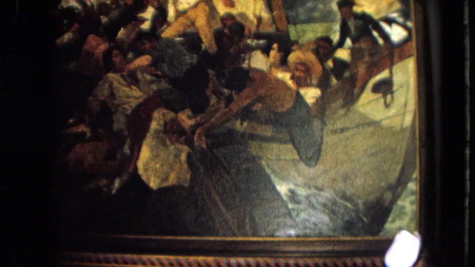 The camera lingers on the dramatic framed painting, with visitors mostly outside the view in the 1964 Venezuela travel clip.