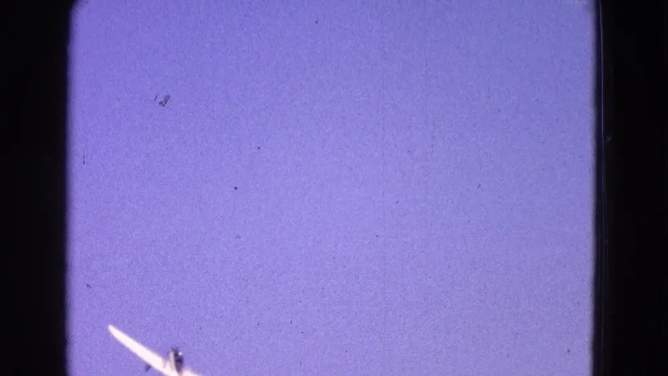 A small white airplane crosses the lower-left portion of the 1964 Washington DC skyward home-movie frame.