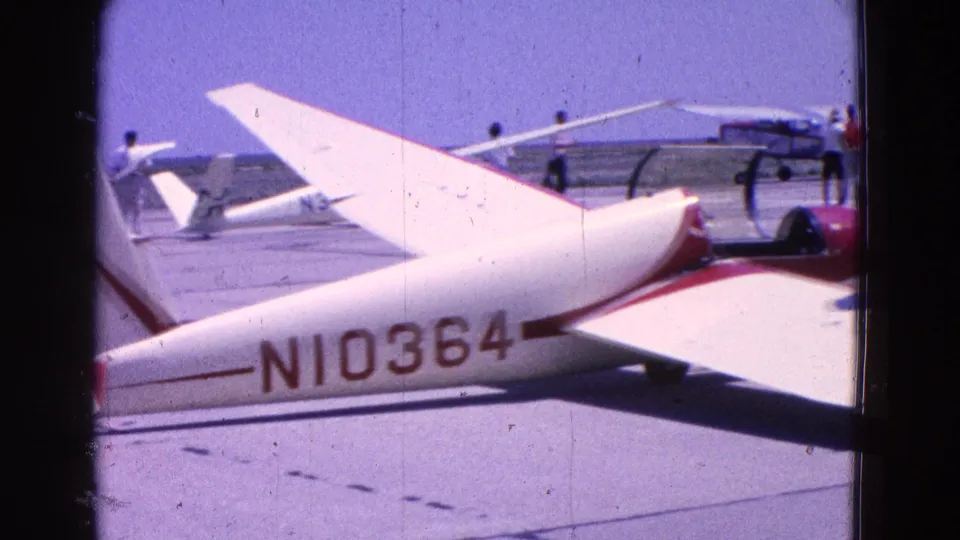 Side view of a white and red glider marked N10364 parked on a Washington, DC-area tarmac in 1964.