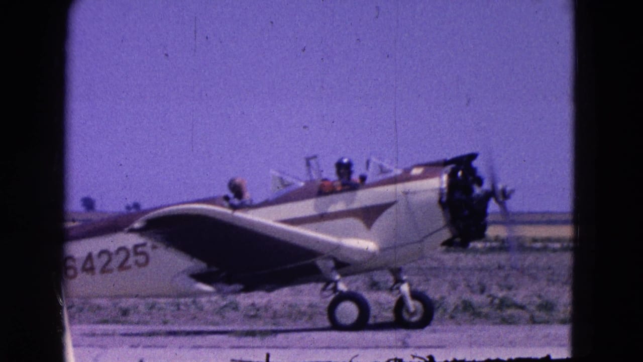 Small plane marked 64225 sits on a runway with its engine visible.