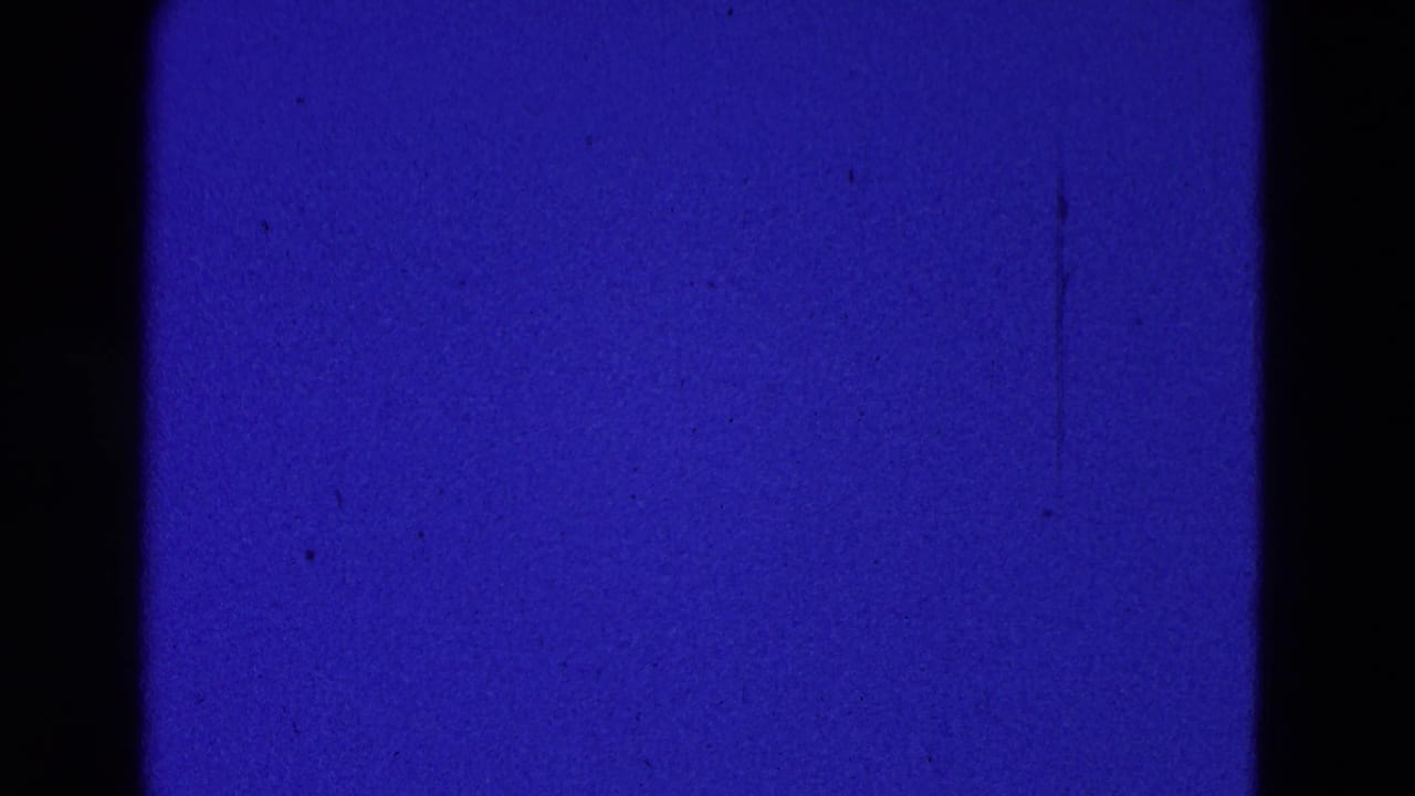 Blue film frame with no clear aircraft visible.