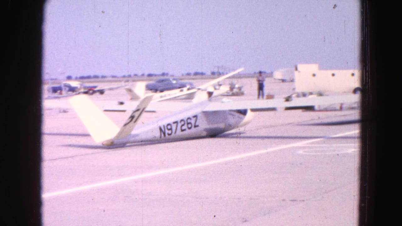 White glider on an airfield tarmac with registration N9726Z visible.