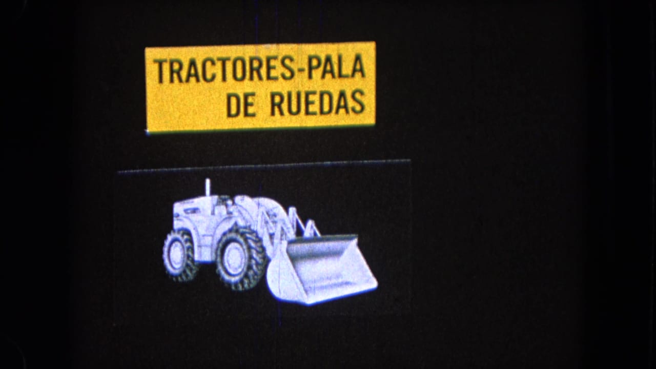 Spanish tractor-loader title card and white front-end loader drawing against a black field.