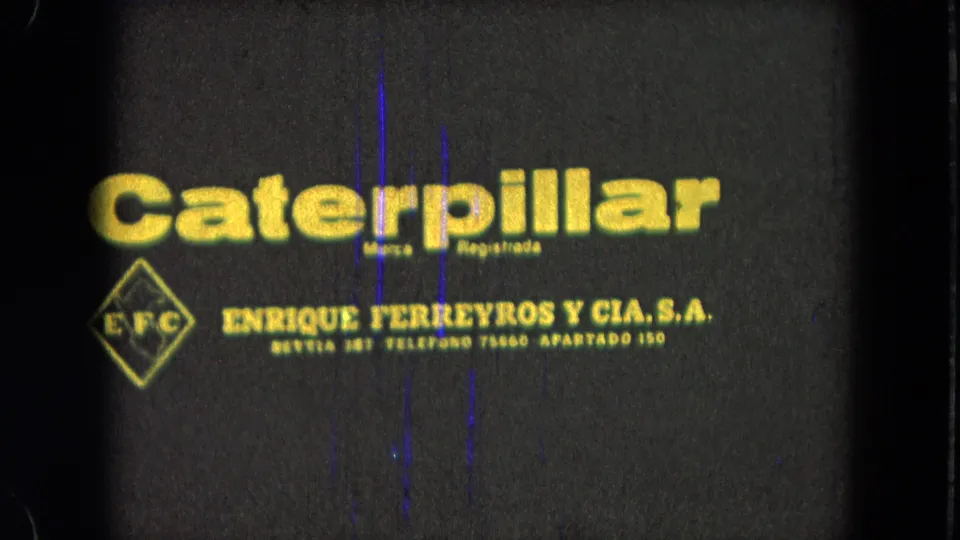 1965 Pueblo, Mexico 8mm frame with a yellow Caterpillar wordmark, EFC diamond, and Enrique Ferreyros y Cia. S.A. text.