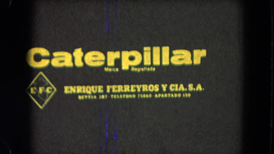 1965 Pueblo, Mexico 8mm frame showing Caterpillar branding above Enrique Ferreyros y Cia. S.A. contact text.