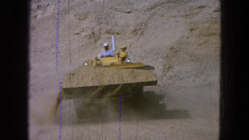 The final frame shows the loader facing camera with its bucket out, operator visible, and dust rising in the 1965 Mexico footage.