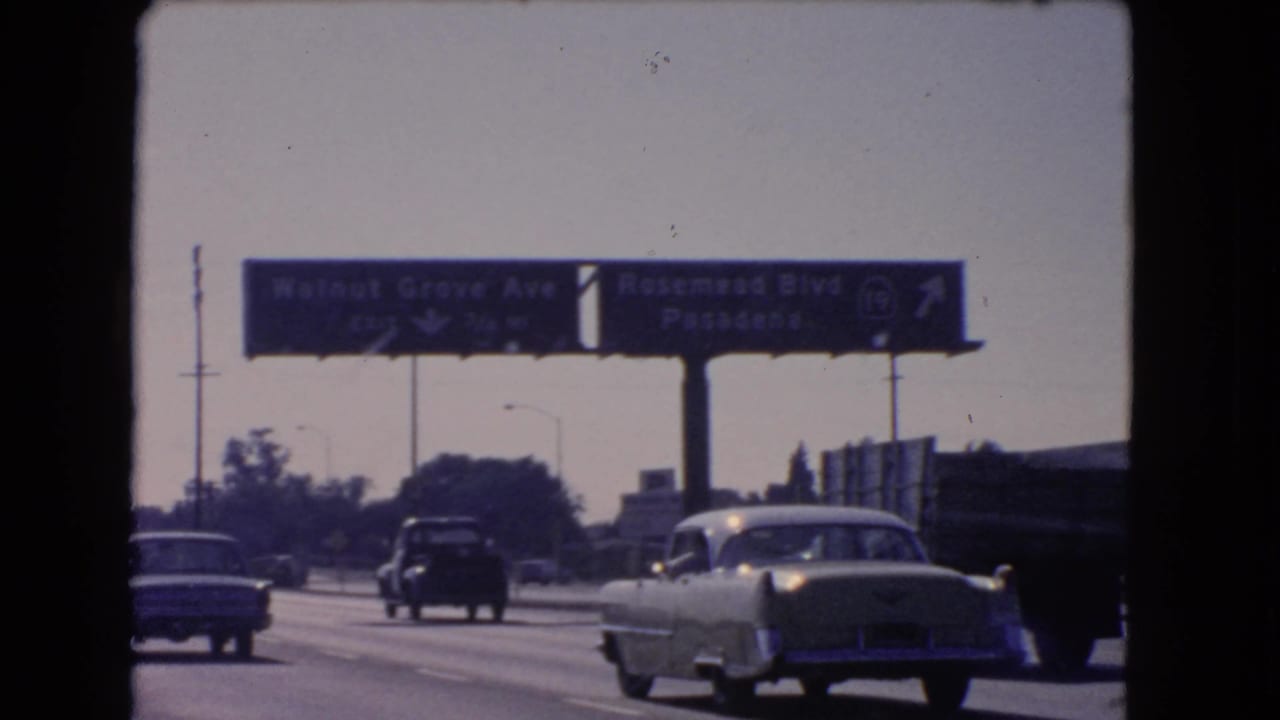 1966 California highway view with mid-century cars moving toward signs for Walnut Grove Ave and Rosemead Blvd Pasadena.
